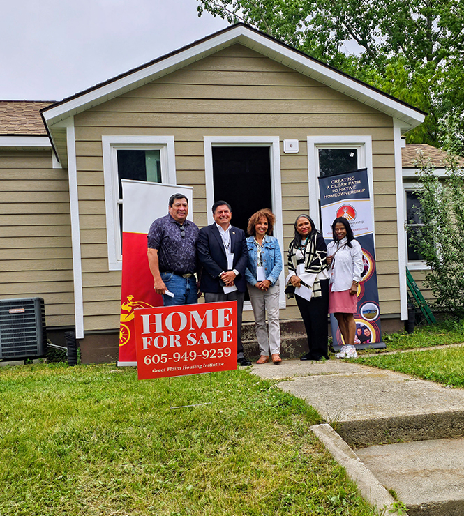 group in front of house for sale